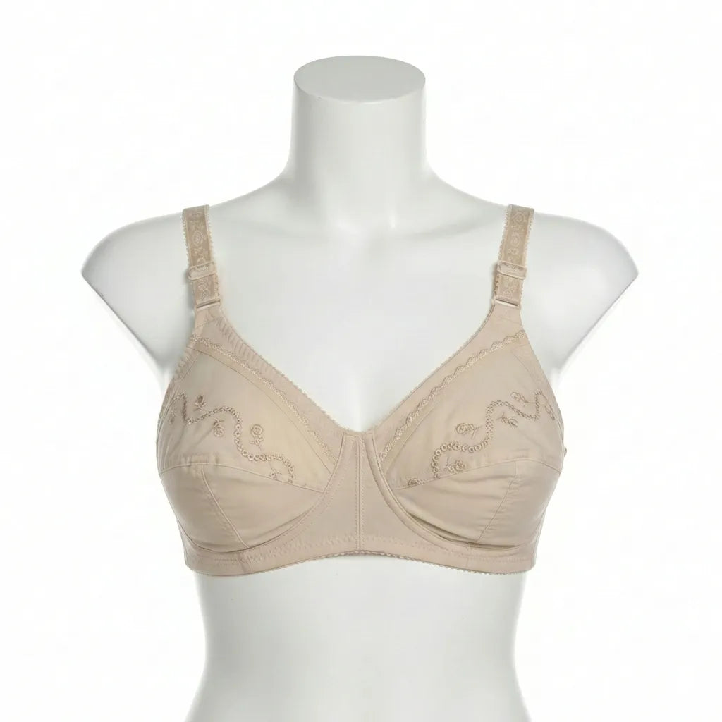 Beige bra on a mannequin against a white background